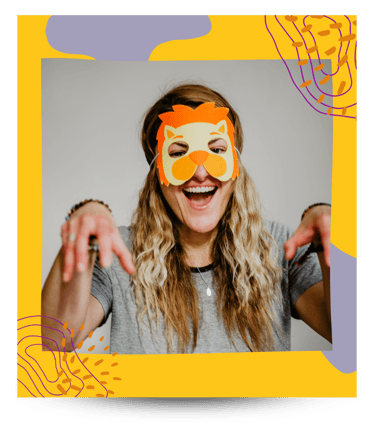 Martina wearing a lion's mask during kids yoga.