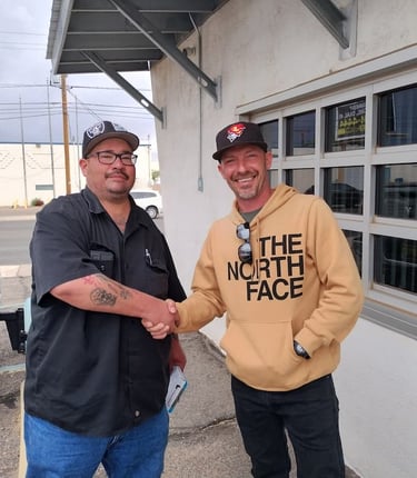 locksmith shaking hands with business owner