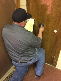 locksmith unlocking a safe