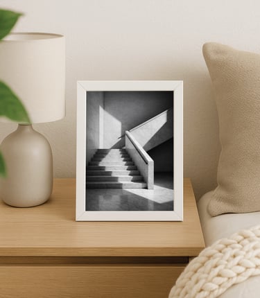 Framed black-and-white wall art print in a minimalist living room