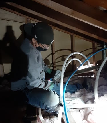 plumber in a ceiling with A-pex