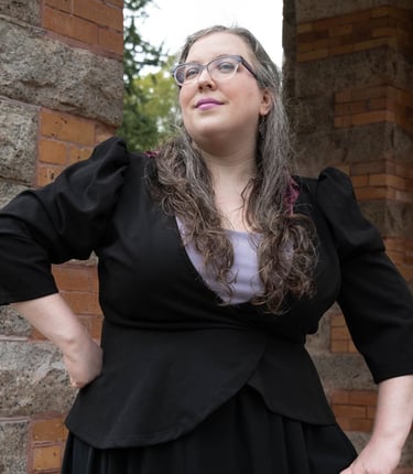 A businesswoman looking confident in front of a stone structure