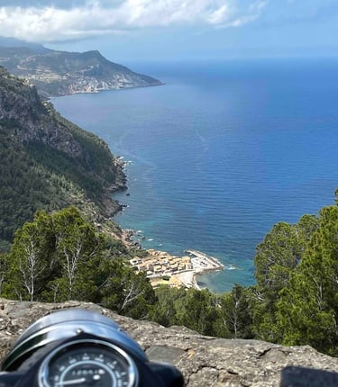 A Royal Enfield Bullet overlooking Valdemossa port in Mallorca