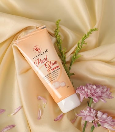 a tube of cream on a silk fabric covered surface