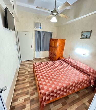 A room with a double bed.