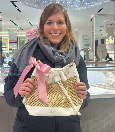 Happy client with her personalized leather bag by NYC calligrapher Handwritten by Belle.