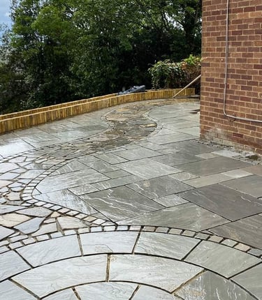 sandstone patio, circle kit, brick wall planter