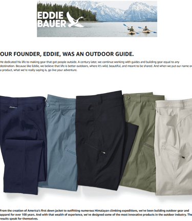 Woman hiking in a forest wearing durable and protective Eddie Bauer Guide Pro Pants