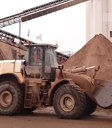 Wiellader die aarde heeft opgepakt