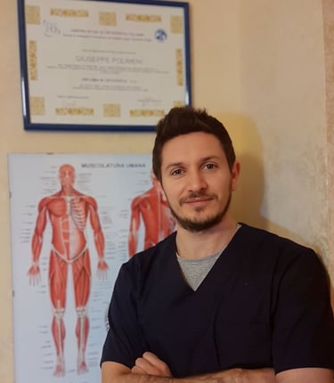 a man in scrubs standing in front of a poster board