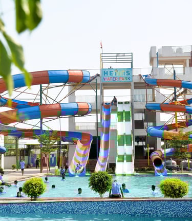 a water slider with a slider in the middle of a pool