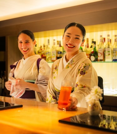 Women dressed in Kimono serving beautiful cocktails