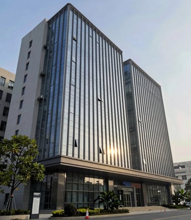 A focused web developer working on a reservation site for a salon at a coffee shop.