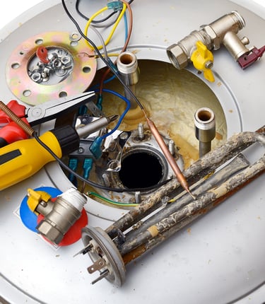 Professional tools and corroded heating element for electric water heater repair service.
