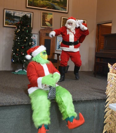 Grinch snuck in to try to steal the show from Santa at the Christmas Market held at the Red Willow