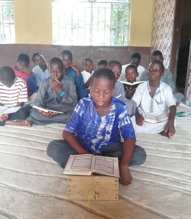 Candid shot of Maakitheena youth focused on their religious studies.