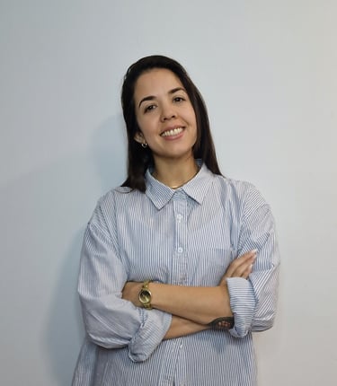 a woman psychologist in a blue shirt and a watch on her wrist