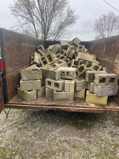 TRAILER OF CONCRETE BRICKS ON RESIDENTIAL CONSTRUCTION CLEANUP SITE