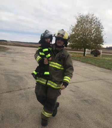 This is an image of the owner of AG's General Contractor and his child.