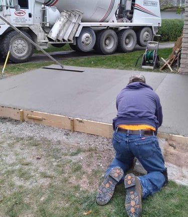 AG's General Contractor finishing up a concrete slab for a customer