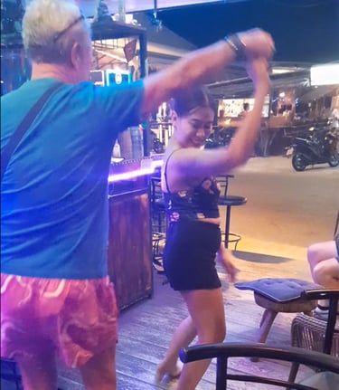 Man and Thai woman dancing at bar on Soi 94 in Hua Hin