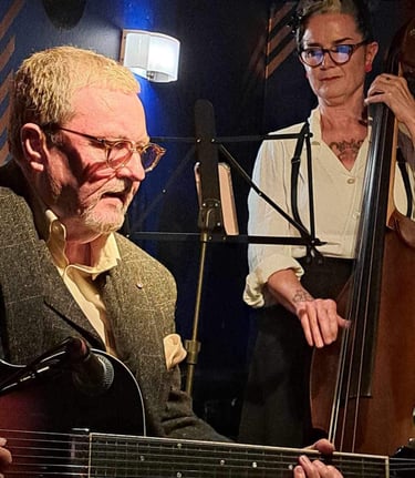 Charlotte Paterson of Celtic Django Project on stage with  jazz guitarist Martin Taylor in Edinburgh