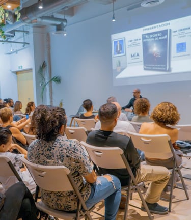 a man in a suit and tie is giving a presentation