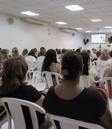 a group of people sitting in chairs in a room