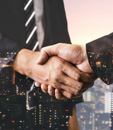 Handshake representing client trust - startup business advice | legal assistance