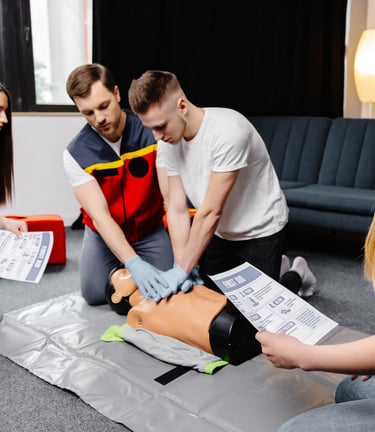 a group of people learning CPR and medical skills