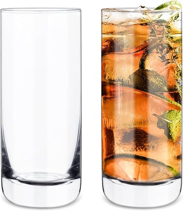 a glass of water with a slice of lemon on the side
