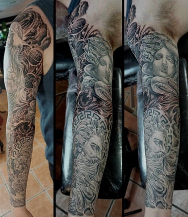 Black and grey Greek themed sleeve tattoo