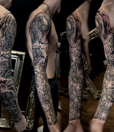 Black and grey Marvel realism sleeve tattoo