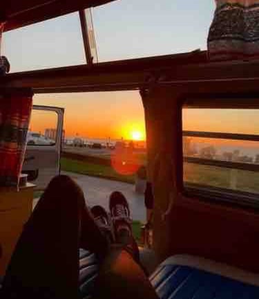 Campervan parked at a remote beach