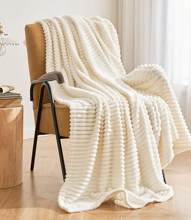 a chair with a blanket on it and a throw blanket