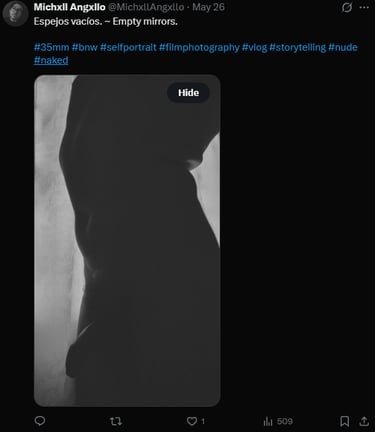 Black and white silhouette of a naked man's torso in profile.