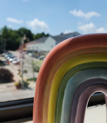 rainbow in window overlooking downtown guelph