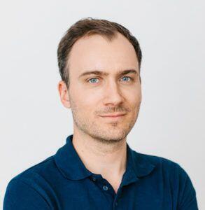 a man in a blue shirt and a white shirt