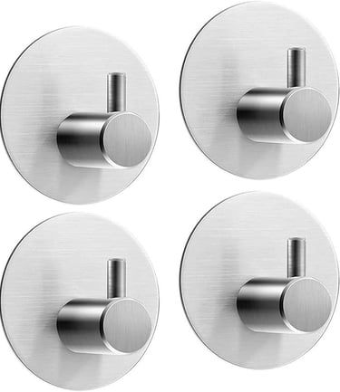 a set of four metal wall mounted hooks