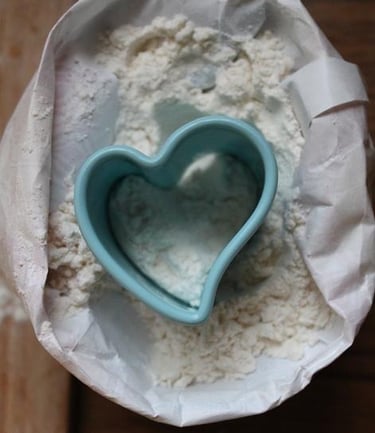 heart shape cutter on flour