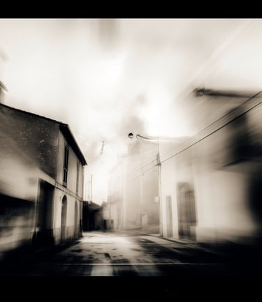 a street scene with a blurry image of a street light