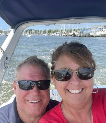 Chesapeake Captain Services LLC owner Tom Bachur & wife Kelly aboard their boat "Discapio"