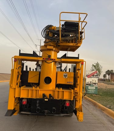 a yellow crane truck with a crane on it