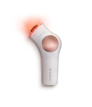 a white and pink hair dryer with a red light on it