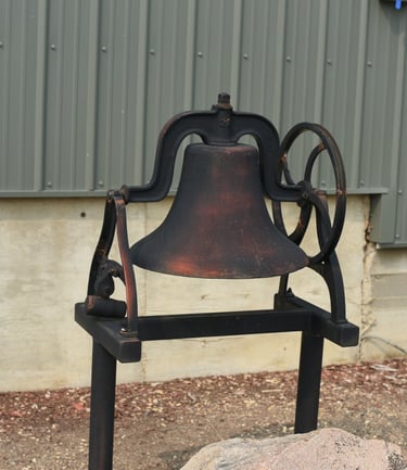 The Red Willow Bell that stands in front of the Red Willow Community Hall