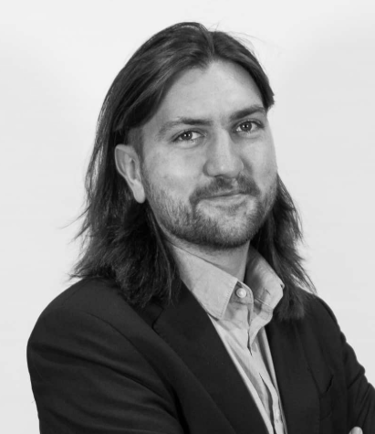 Expert in Blockchain with long hair and a beard and a watch on his wrist