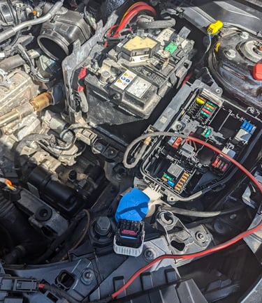 a car engine with a lot of wires and wires
