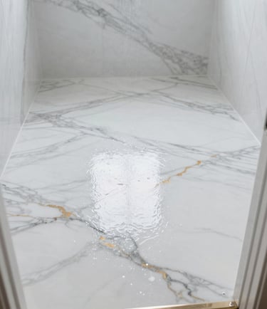 Freshly installed decorative epoxy resin floor with marble-effect finish, showing wet gloss & light