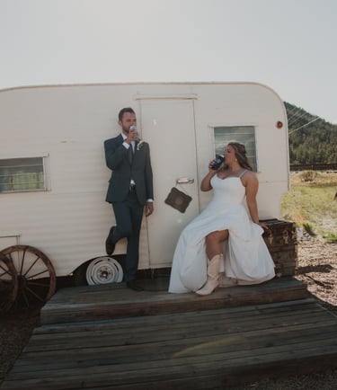 couple toasting in front of RV