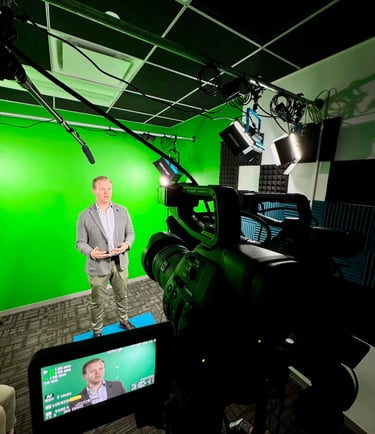 Nick Reese in front of a green screen recording a speaking enagement